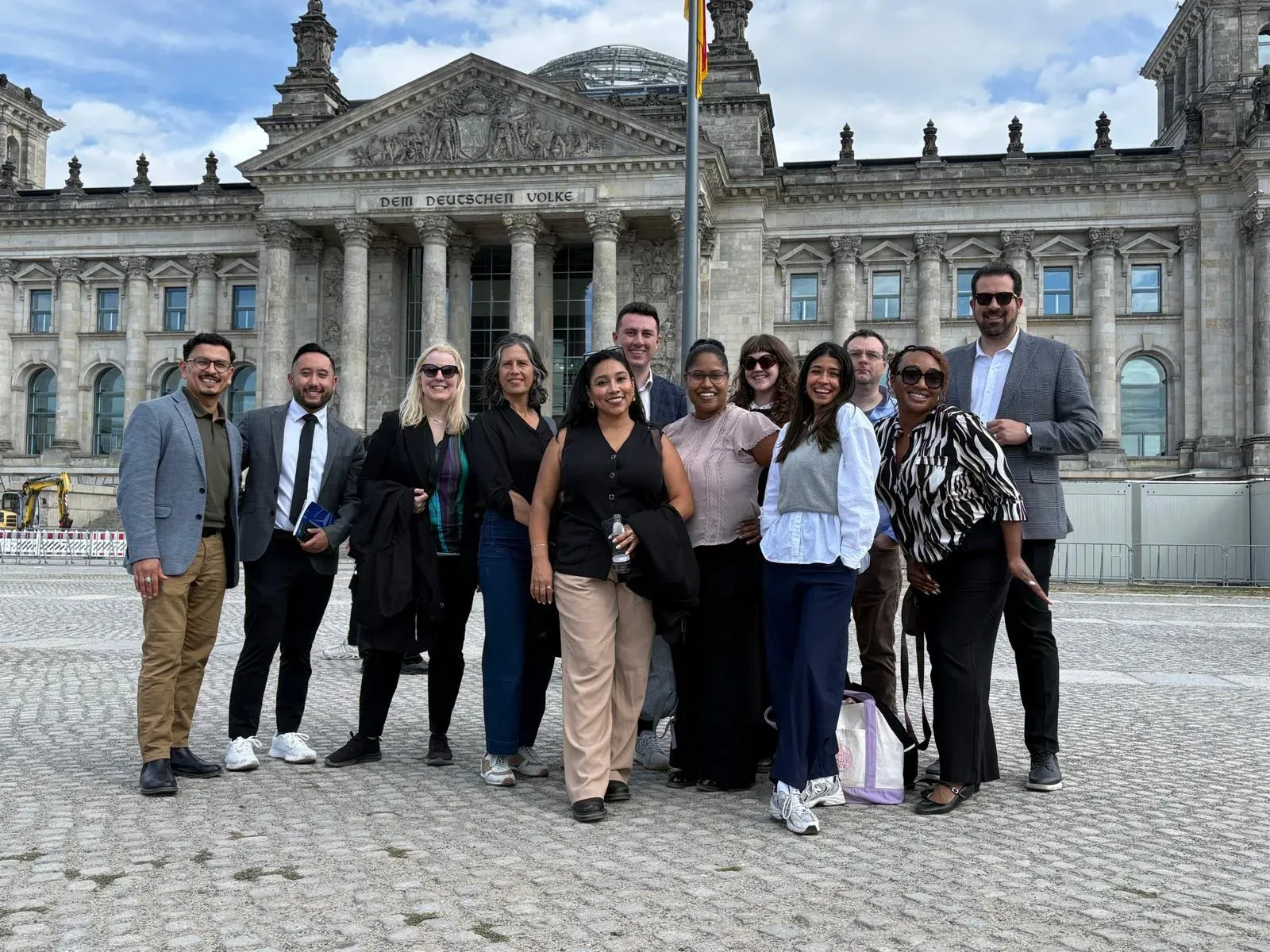 The participants of the RIAS program in September 2026 in front of the Reichstag building in Berlin